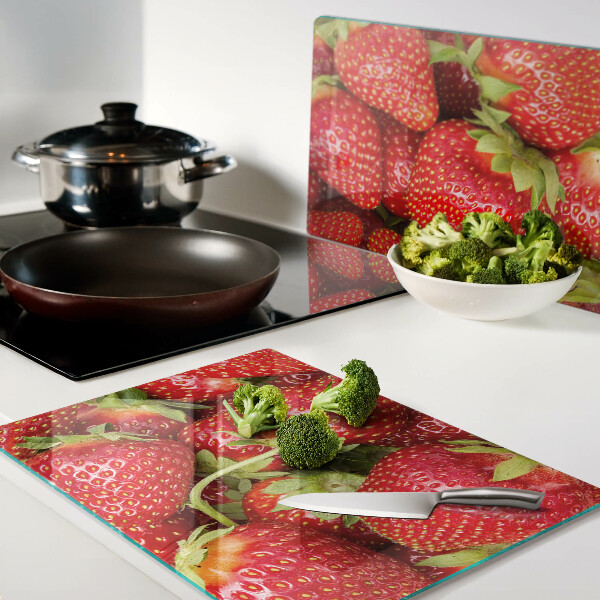 Glazen snijplanken Aardbeien op de achtergrond