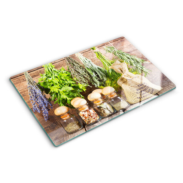 Snijplanken van glas Kruiden en specerijen op een houten achtergrond