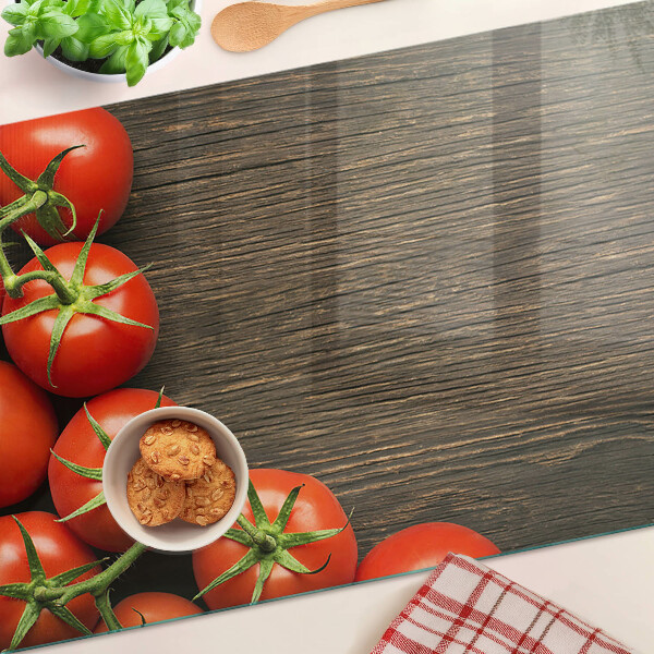 Snijplanken glas Tomaten op een houten achtergrond