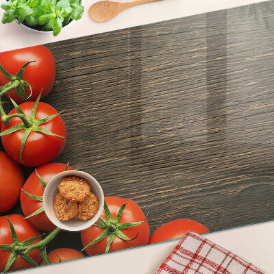 Snijplanken glas Tomaten op een houten achtergrond