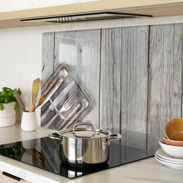 Snijplanken van glas Rustiek bestek op een houten achtergrond