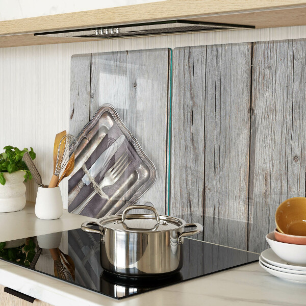 Snijplanken van glas Rustiek bestek op een houten achtergrond