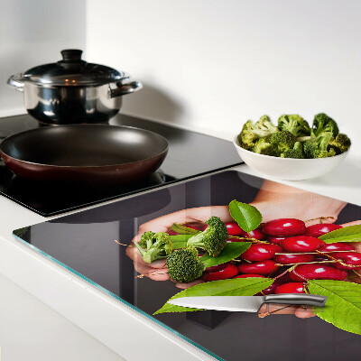 Glazen snijplanken Rode kersen in de hand