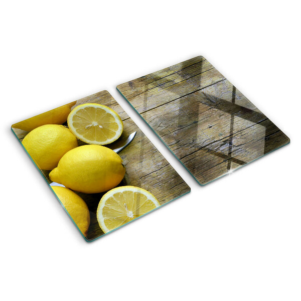 Snijplanken glas Citroenen op een houten achtergrond