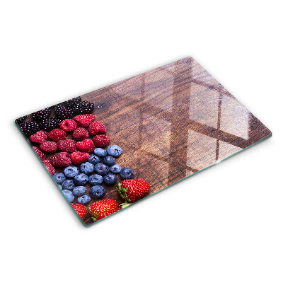 Glazen snijplanken Bosvruchten op een houten achtergrond