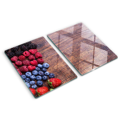 Glazen snijplanken Bosvruchten op een houten achtergrond