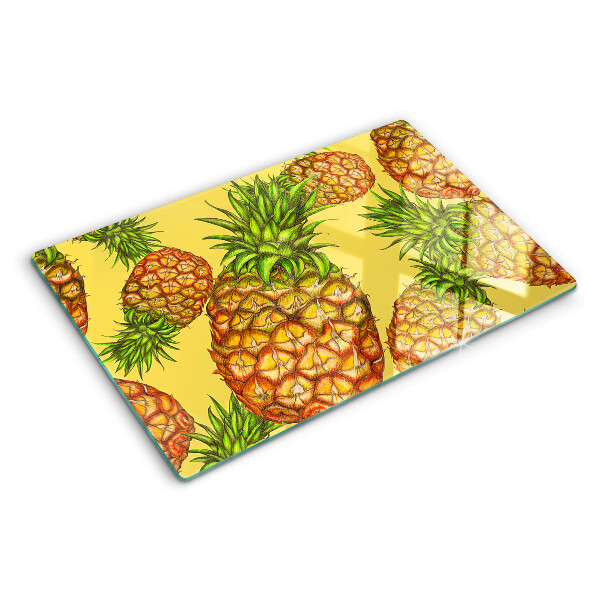 Snijplanken glas Ananassen op een gele achtergrond