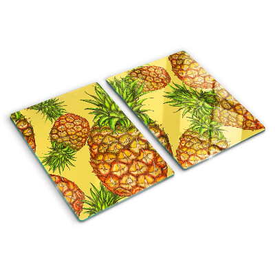 Snijplanken glas Ananassen op een gele achtergrond