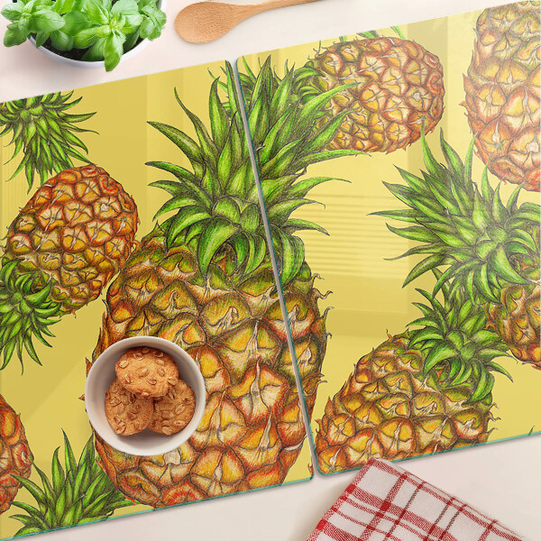 Snijplanken glas Ananassen op een gele achtergrond