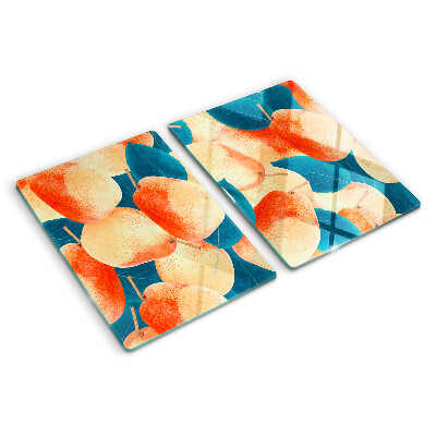 Glazen snijplanken Perziken tegen een achtergrond van bladeren