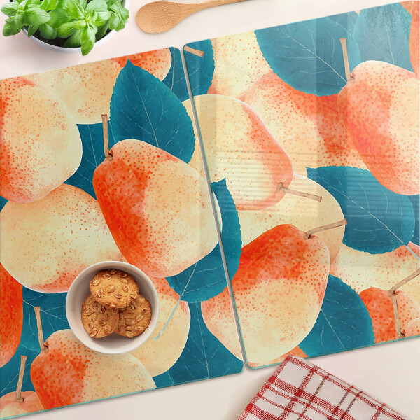 Glazen snijplanken Perziken tegen een achtergrond van bladeren