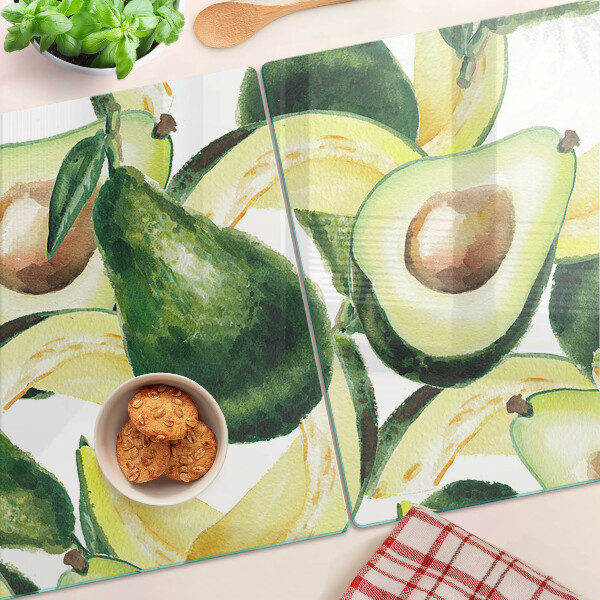 Snijplanken van glas Avocado met bladeren op de achtergrond