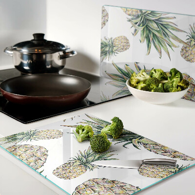 Glazen snijplanken Ananassen op een witte achtergrond