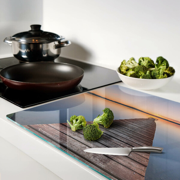 Glazen snijplanken De steiger aan het meer bij zonsondergang