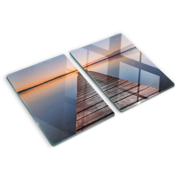 Glazen snijplanken De steiger aan het meer bij zonsondergang