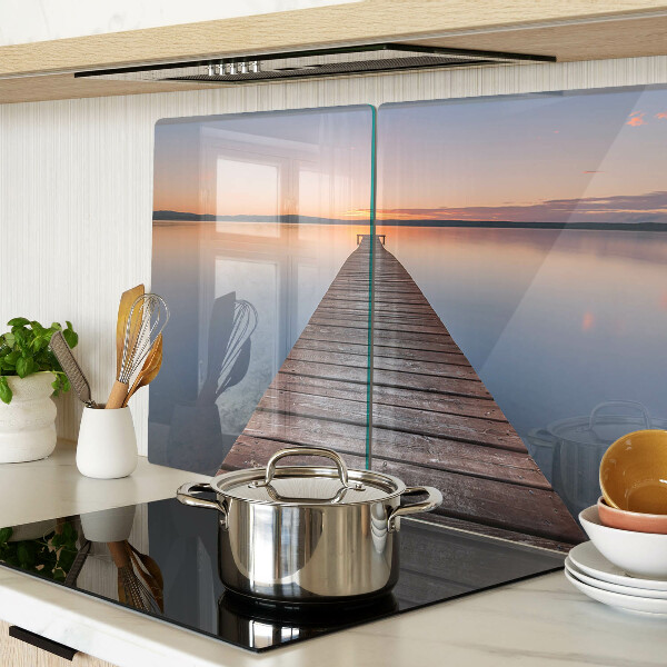 Glazen snijplanken De steiger aan het meer bij zonsondergang