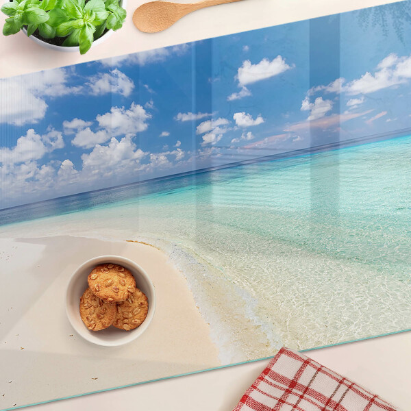 Snijplanken van glas Strand met een blauwe lucht