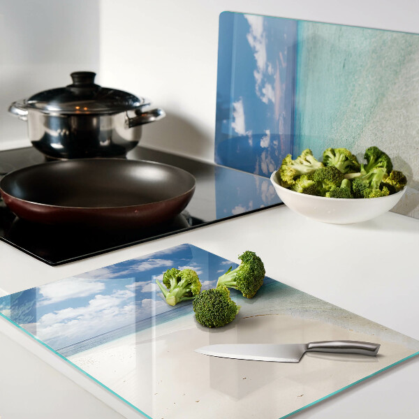 Snijplanken van glas Strand met een blauwe lucht