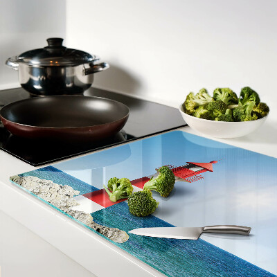 Snijplanken van glas Een vuurtoren boven de oceaan