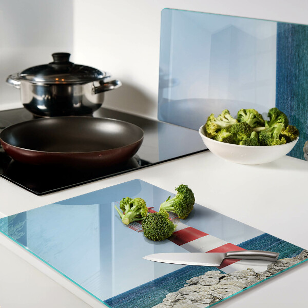 Snijplanken van glas Een vuurtoren boven de oceaan