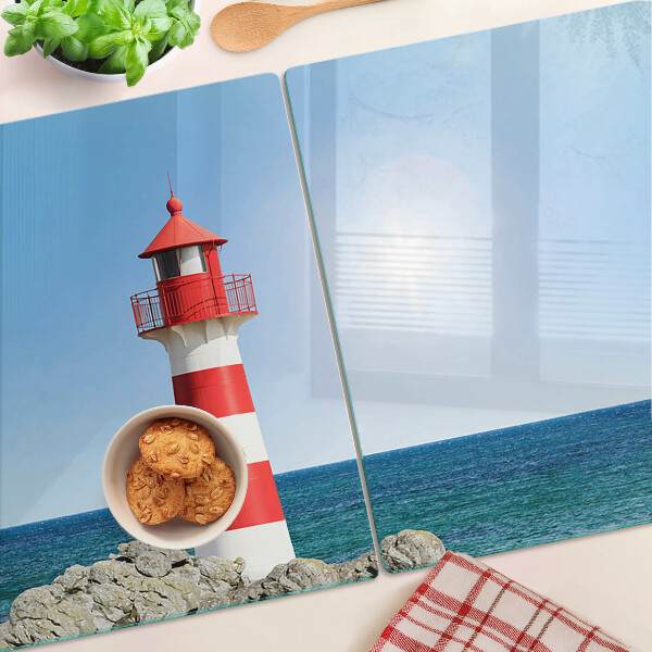 Snijplanken van glas Een vuurtoren boven de oceaan