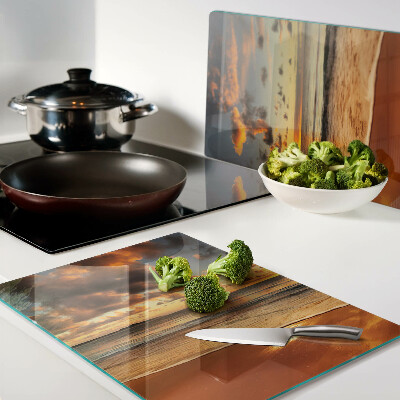 Snijplanken van glas Zonsondergang boven de zee