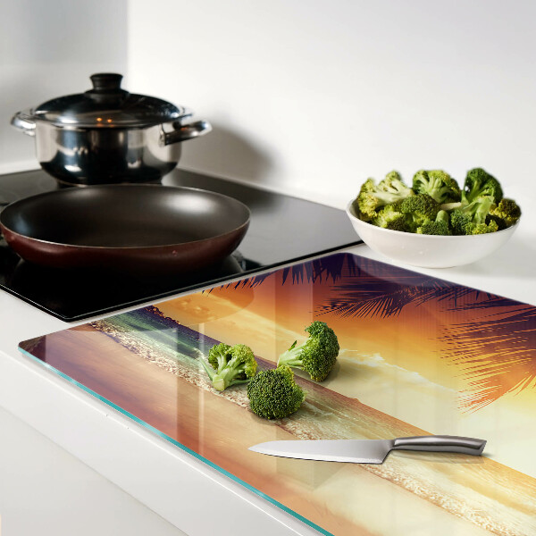 Snijplanken van glas Zonsondergang boven het strand