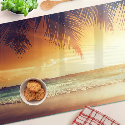 Snijplanken van glas Zonsondergang boven het strand