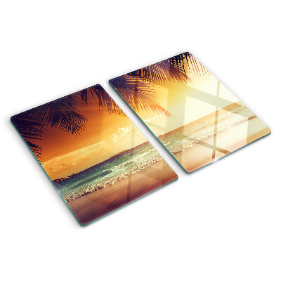 Snijplanken van glas Zonsondergang boven het strand