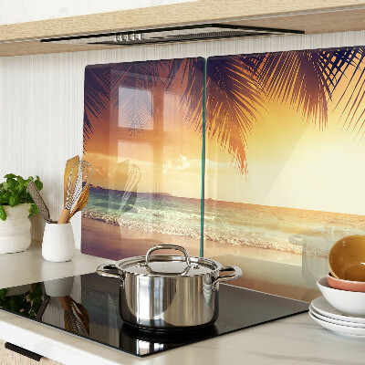 Snijplanken van glas Zonsondergang boven het strand