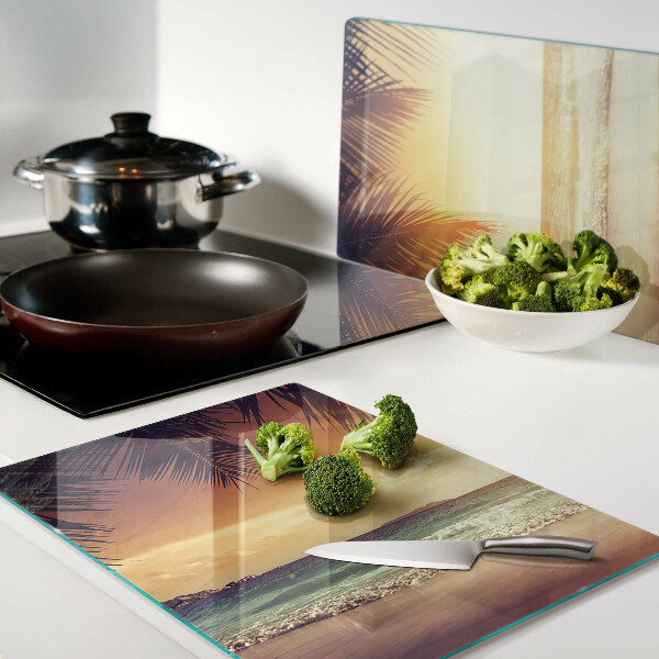 Snijplanken van glas Zonsondergang boven het strand