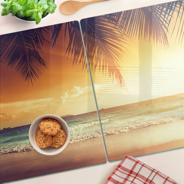 Snijplanken van glas Zonsondergang boven het strand