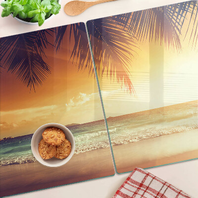 Snijplanken van glas Zonsondergang boven het strand