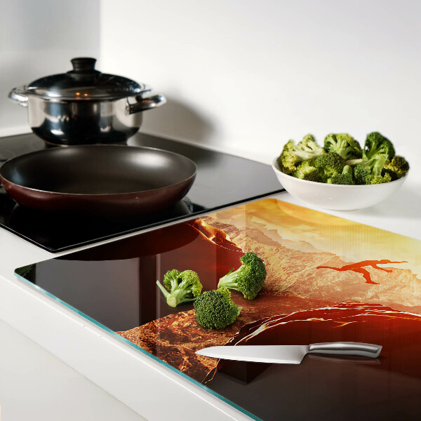 Glazen snijplanken Springen in de bergen bij zonsondergang