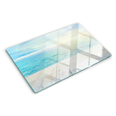 Snijplanken van glas De zee en de houten steiger