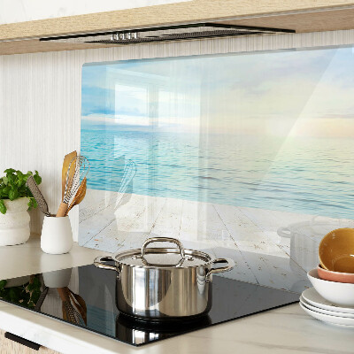 Snijplanken van glas De zee en de houten steiger