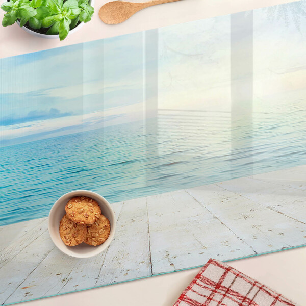 Snijplanken van glas De zee en de houten steiger