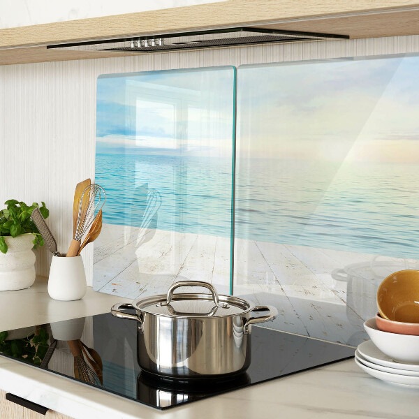 Snijplanken van glas De zee en de houten steiger