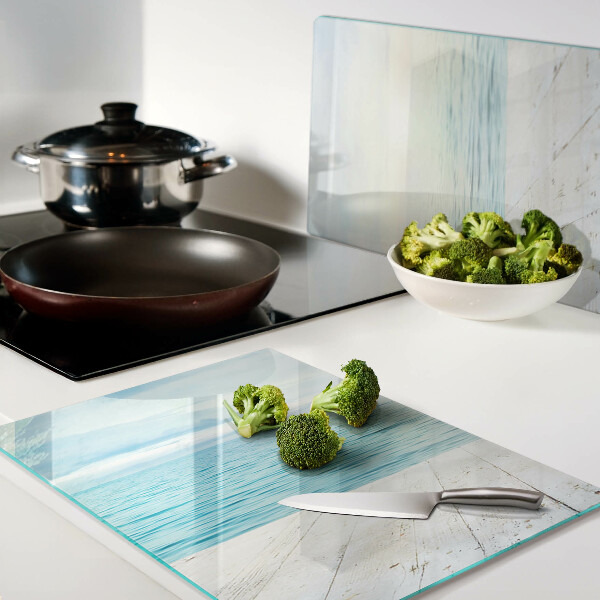 Snijplanken van glas De zee en de houten steiger