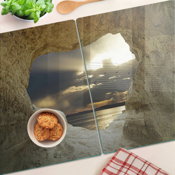 Snijplanken glas Uitzicht op de zee door de grot.