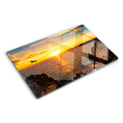 Snijplanken van glas Zonsondergang boven de zee