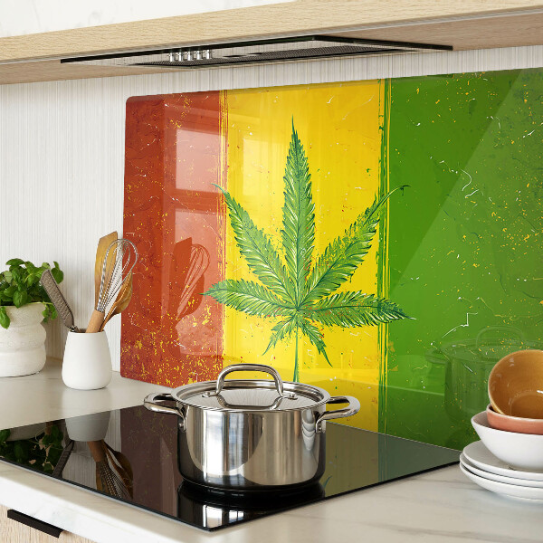 Snijplanken van glas Cannabisblad op een kleurrijke achtergrond