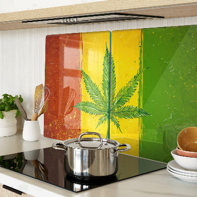 Snijplanken van glas Cannabisblad op een kleurrijke achtergrond