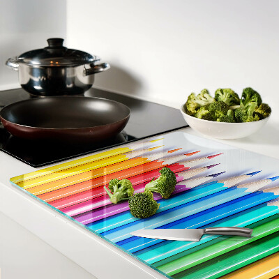 Glazen snijplanken Gekleurde potloden op een rij