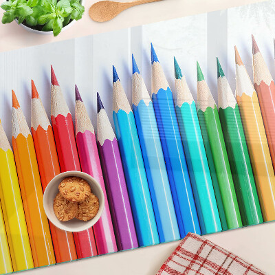 Glazen snijplanken Gekleurde potloden op een rij