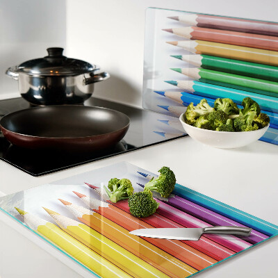 Glazen snijplanken Gekleurde potloden op een rij