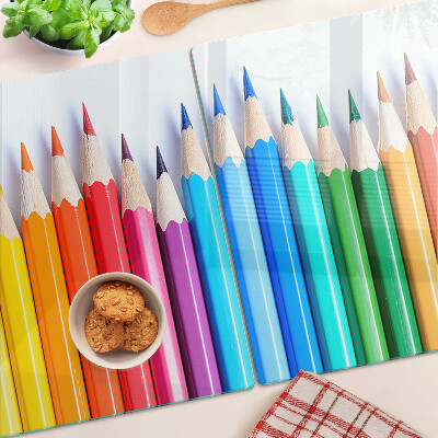 Glazen snijplanken Gekleurde potloden op een rij
