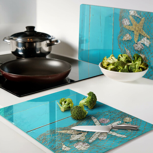 Snijplanken glas Schelpen en zeesterren in een net