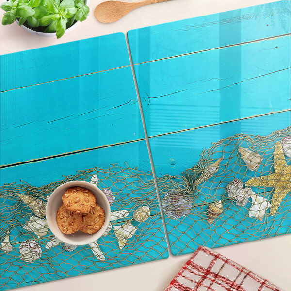 Snijplanken glas Schelpen en zeesterren in een net