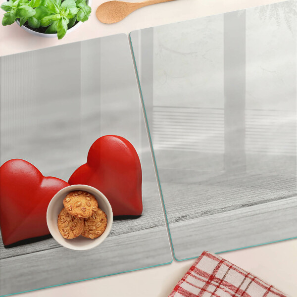 Snijplanken glas Rode harten op een houten achtergrond